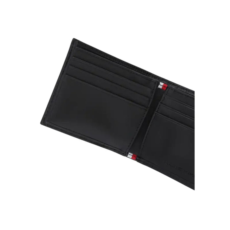 Tommy Hilfiger men wallet in black leather with red white and blue striped stitching along the edges