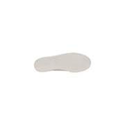 White rubber sole of tommy hilfiger men’s beige slip on cotton sneakers with smooth slightly textured surface