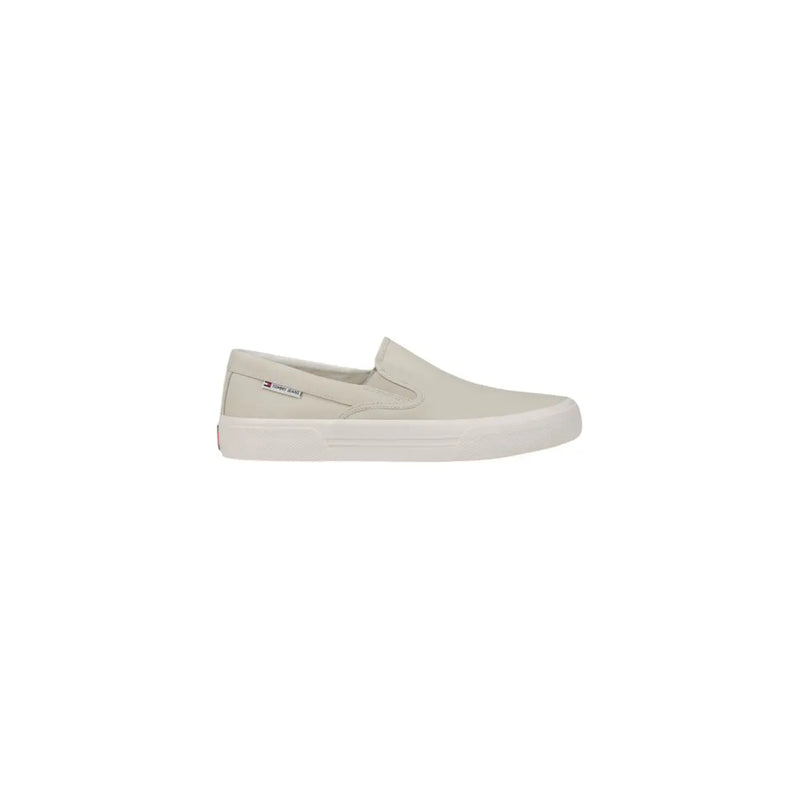 Back view of tommy hilfiger men’s beige slip-on sneakers in cotton canvas with white rubber sole and subtle heel branding
