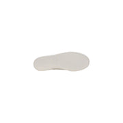 White rubber sole of tommy hilfiger men’s beige slip on cotton sneakers with smooth slightly textured surface