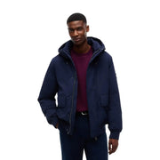 Tommy Hilfiger puffer jacket for men in navy blue with front zipper and two side pockets, front view