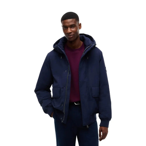 Tommy Hilfiger puffer jacket for men in navy blue with front zipper and two side pockets, front view