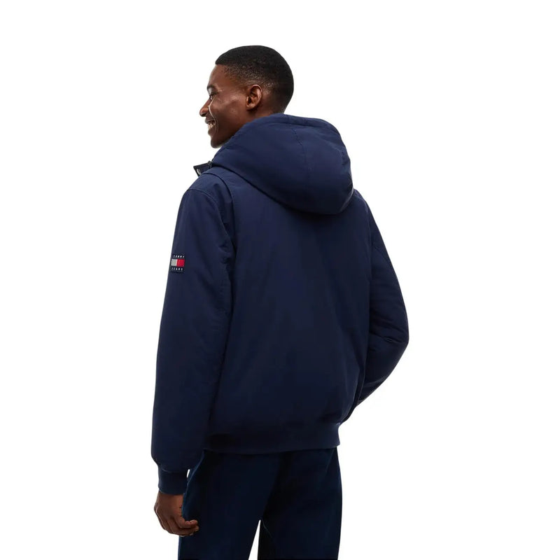 Tommy Hilfiger puffer jacket for men in navy blue with small flag logo on left sleeve, front view