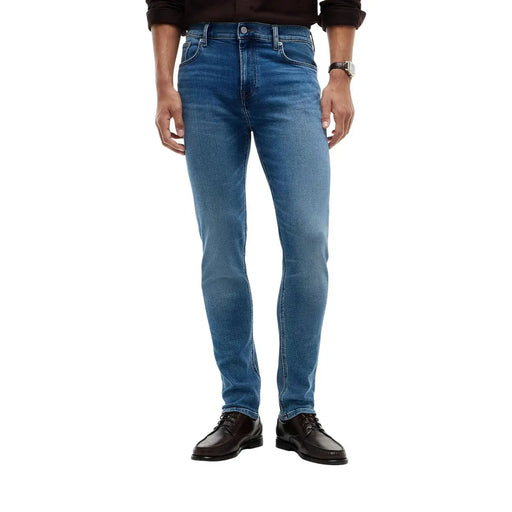 Tommy Hilfiger slim fit jeans Bleecker for men in blue denim with classic five-pocket design and subtle fading front view