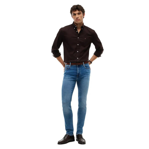 Tommy hilfiger slim fit jeans bleecker for men in dark brown with small logo on left chest front view