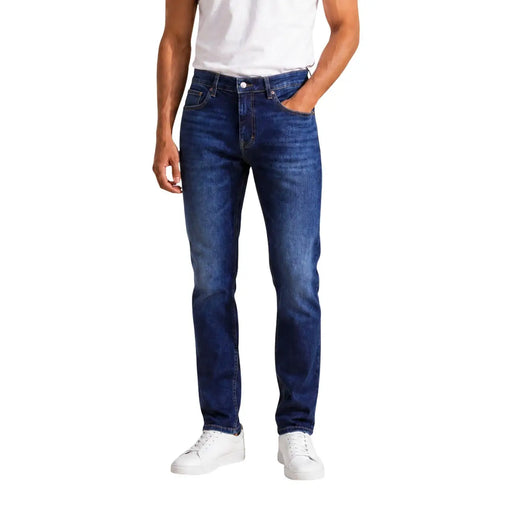 Tommy Hilfiger slim fit jeans for men in dark blue denim with subtle fading and straight-leg cut, front view