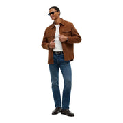 Tommy hilfiger slim fit jeans for men in blue worn by model with brown suede jacket chest pockets collar visible front view