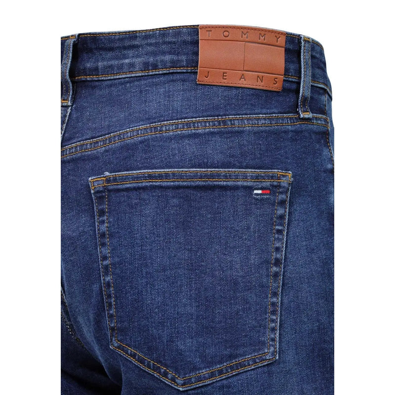 Tommy Hilfiger slim fit jeans for men in dark blue denim with brown leather logo patch and flag on back pocket back view
