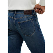 Tommy Hilfiger slim fit jeans for men in dark blue denim with five-pocket design and logo embroidery back view