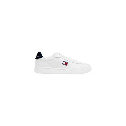 White leather sneaker with black accents and red detailing, featuring a ’gucci’ logo.