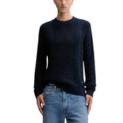 Navy blue cable knit sweater with a crew neck and long sleeves.