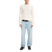 Light blue straight-leg jeans with a classic fit and black belt