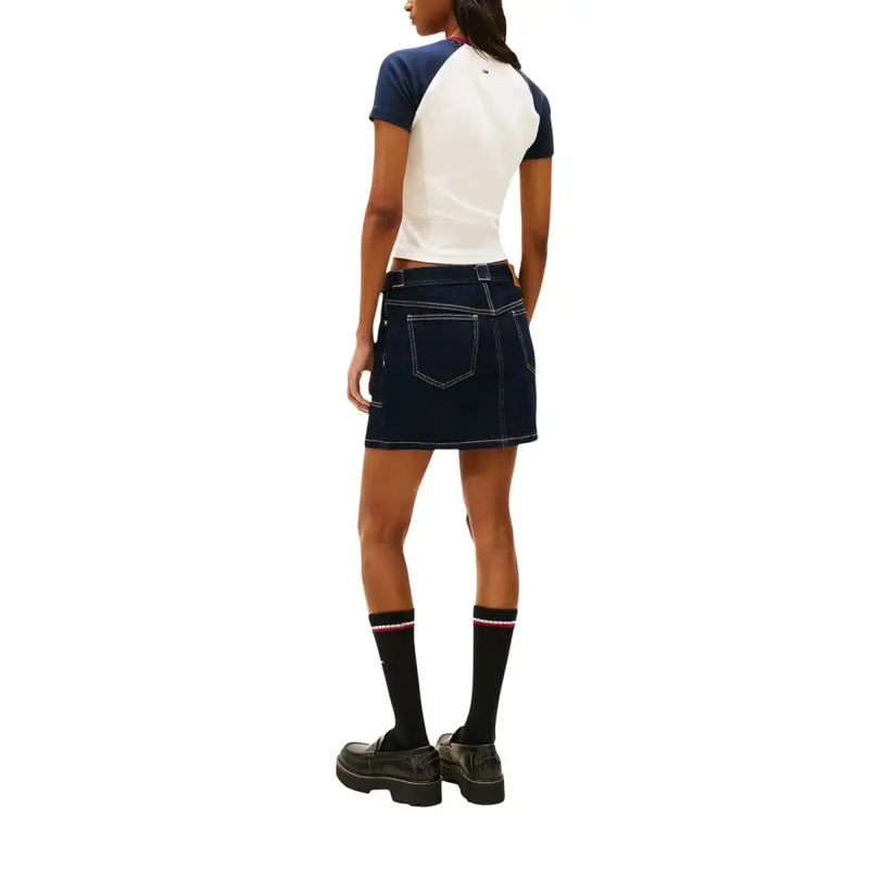 Dark blue denim mini skirt with white stitching and back pockets shown with tommy hilfiger white printed organic cotton t-shirt for women