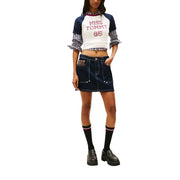 Dark blue denim mini skirt with white stitching and brown leather patch paired with tommy hilfiger organic cotton t-shirt for women