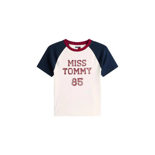 Cream-colored tommy hilfiger miss tommy 85 raglan organic cotton tee with navy sleeves maroon collar and glittery red lettering