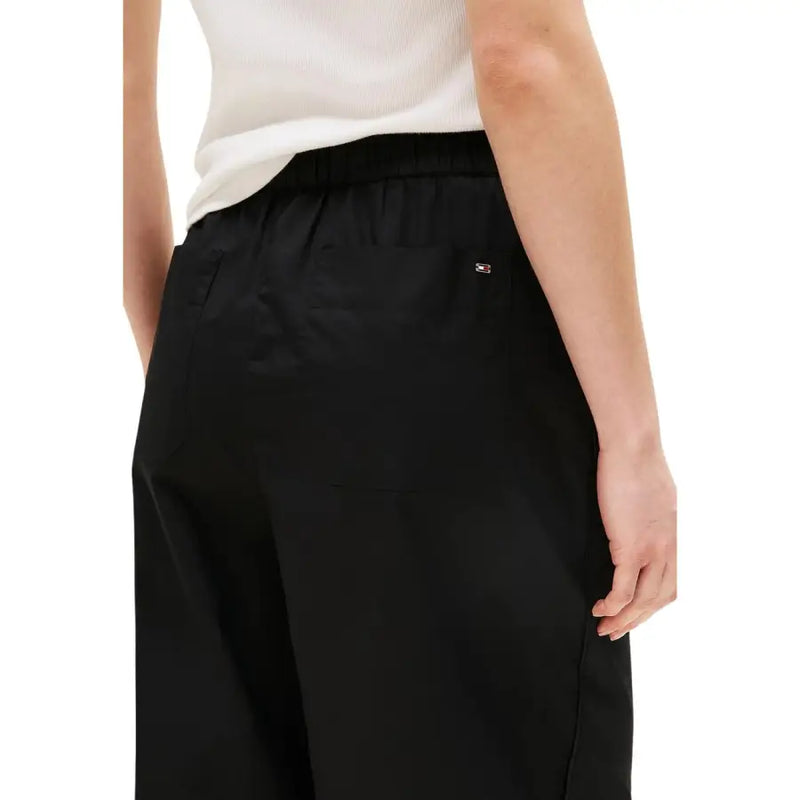 Black tommy hilfiger wide-leg organic cotton trousers with elastic waistband and logo patch on the back pocket back view