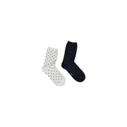 A pair of tommy hilfiger women socks with one white black polka dot and one navy blue cotton blend size s