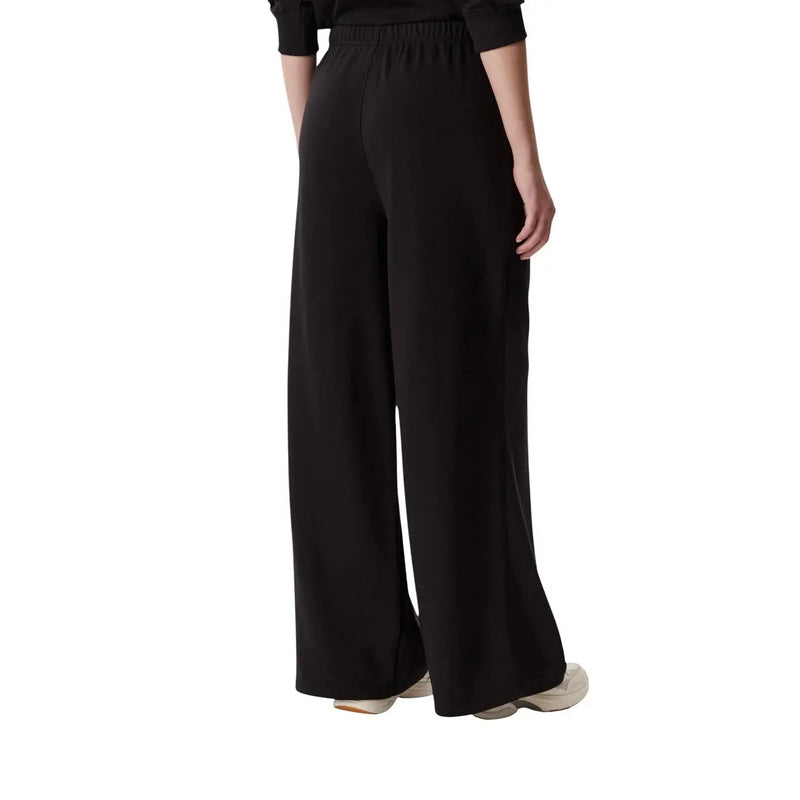 Black wide leg cotton sweatpants for women by Tommy Hilfiger with an elastic waistband front view