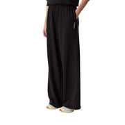 Tommy Hilfiger women wide leg sweatpants in black cotton with soft flowing fabric and subtle side branding