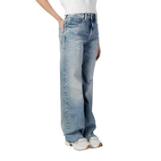 Tommy Hilfiger women’s blue organic cotton jeans with a relaxed wide-leg cut and subtle distressing details