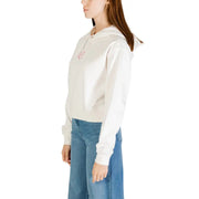 Tommy Hilfiger womens organic cotton cream-colored cropped hoodie with a small pink embroidered rose on the chest