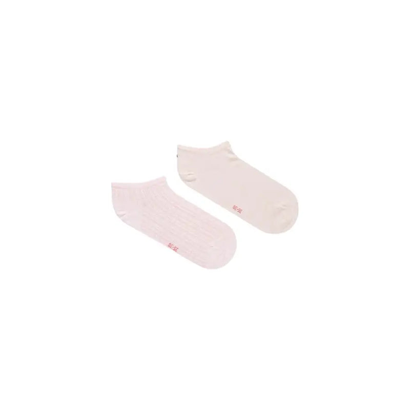 A pair of tommy hilfiger women’s pink cotton ankle socks with soft texture and small red branding on the side