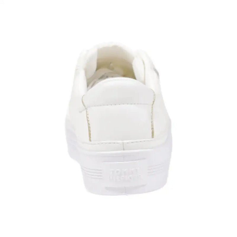 Tommy Hilfiger women’s white cotton platform sneaker with minimalist design and subtle gold stitching along seams