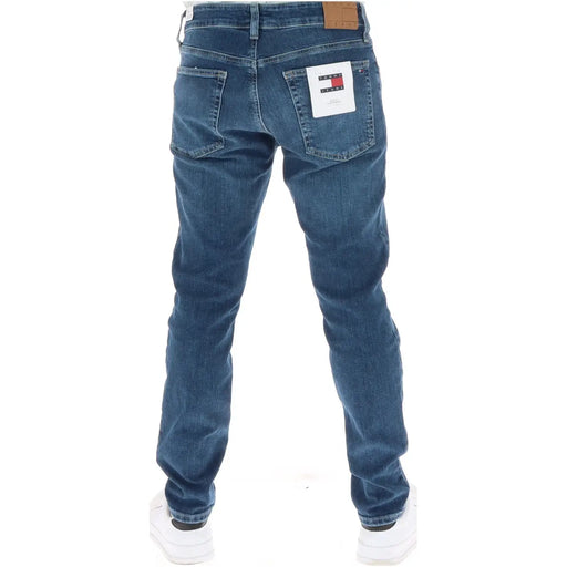Tommy Jeans jeans for men in blue denim with brown leather brand patch and white label on back pocket back view