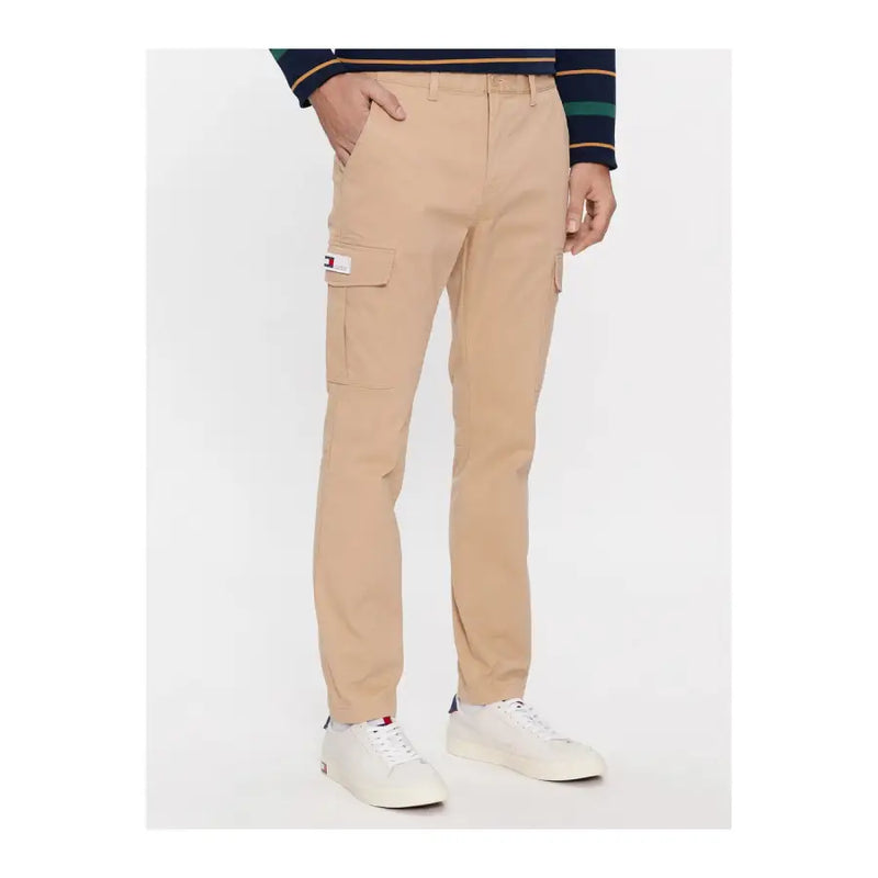 Men’s beige slim-fit cargo trousers with side pockets and a small flag logo