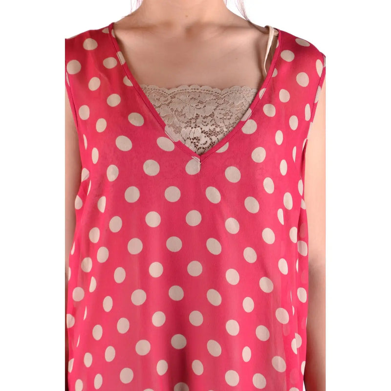 A vibrant pink sleeveless polyester tank top by Simona Barbieri with white polka dots and lace trim at the v-neckline