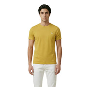A mustard yellow short sleeved crew neck u.s. Polo Assn. men t-shirt with a small embroidered logo on the left chest