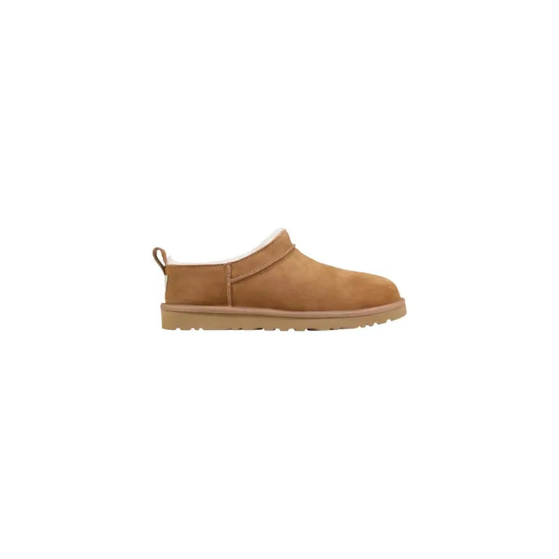 Tan suede Ugg men slip-on shoes with soft white shearling lining and rubber sole for spring and summer use