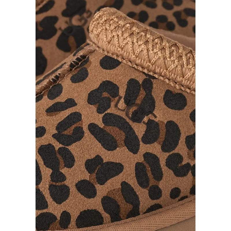 Tan leopard-print ugg men suede slipper with braided trim and soft suede texture rubber sole visible