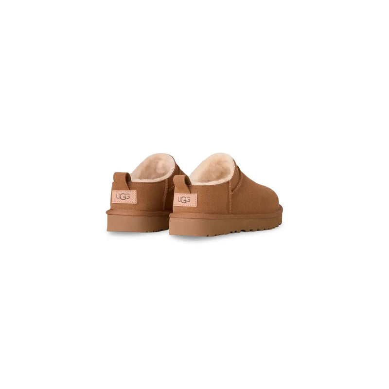 Tan ugg women leather slip on booties with plush shearling lining and suede exterior for spring summer wear