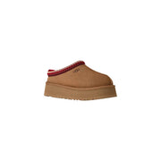 Ugg women suede platform slippers in beige with tan slip-on mule design and red and white patterned trim around the opening