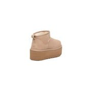 Ugg women’s beige suede ankle boots with plush shearling lining and tan rubber sole for fall winter collection
