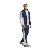 Under armour men blue polyester woven trousers with white and blue color-blocked hooded tracksuit featuring contrasting panels and stripes