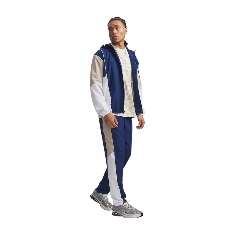 Under armour men blue polyester woven trousers with white and blue color-blocked hooded tracksuit featuring contrasting panels and stripes