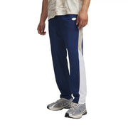 Under armour men blue polyester woven trousers with navy blue and white side stripes and small oval logo on waistband