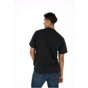 Vans men black cotton short-sleeved round neck t shirt front view with a crew neck design