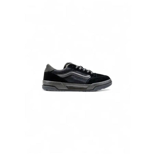 Black velcro strap sneaker with white sole and stitching, possibly by vans.