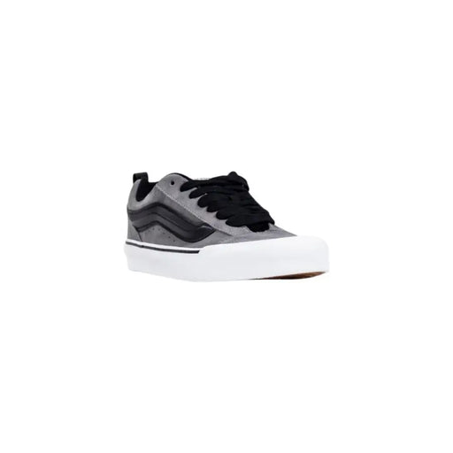 Black and gray vans skate shoe with white sole.