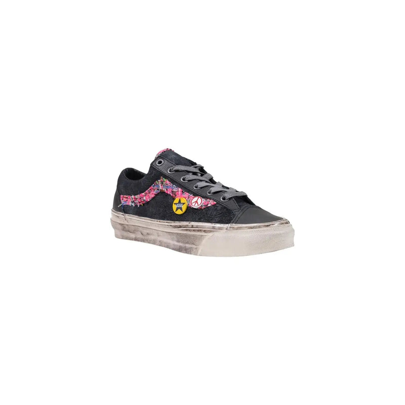 Vans Herren Leder Low-Sneakertop Schwarze Sneaker mit abgenutzter weißer Sohle, lila-pinker Blumenstickerei und gelbem Sternenaufnäher