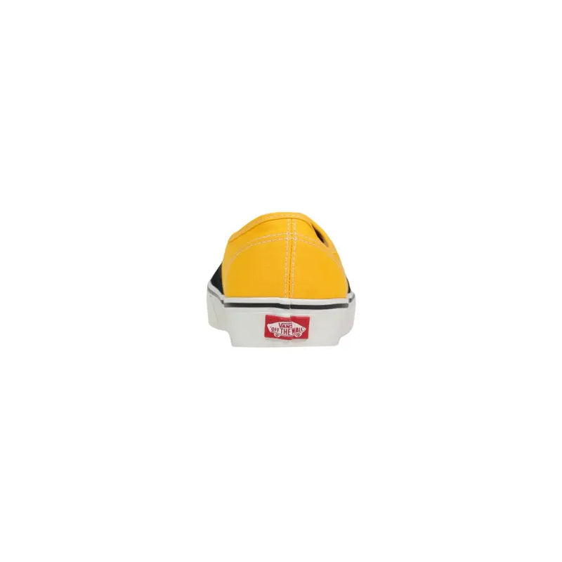 Bright yellow canvas slip-on vans men sneakers with black rubber sole white midsole and red logo on the heel back side