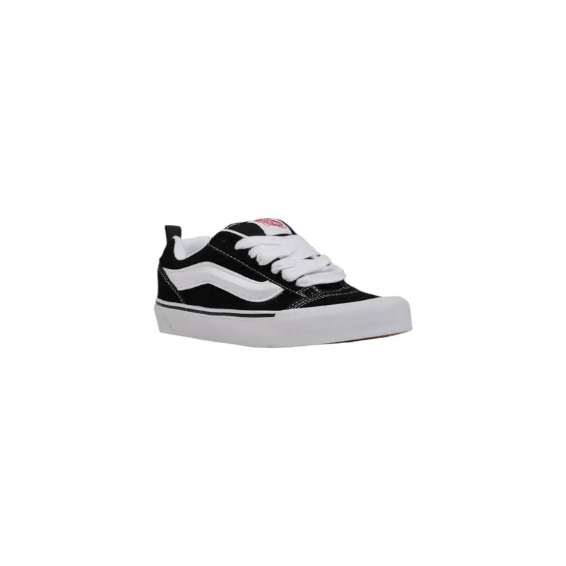 Black and white vans women leather sneakers with canvas upper rubber sole and iconic side stripe for fall wear