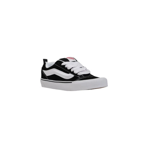 Schwarze und weiße Vans Damen-Sneaker aus Leder mit Canvas-Obermaterial, Gummisohle und dem ikonischen Seitenstreifen – perfekt für den Herbst.