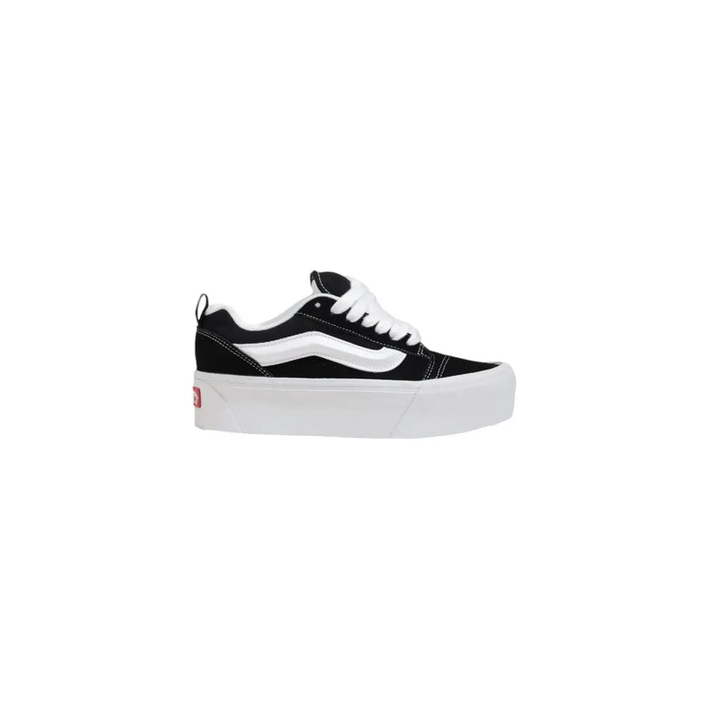 Vans women leather sneakers in black with thick rubber soles and classic old skool platform design in black and white