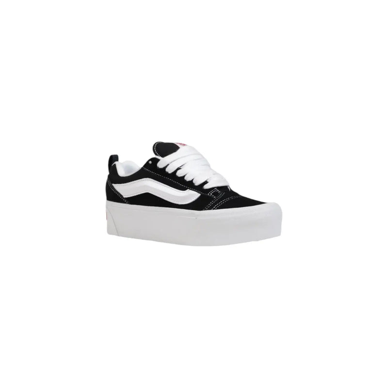 Black vans women leather sneakers featuring white laces, a signature side stripe, and thick white rubber soles
