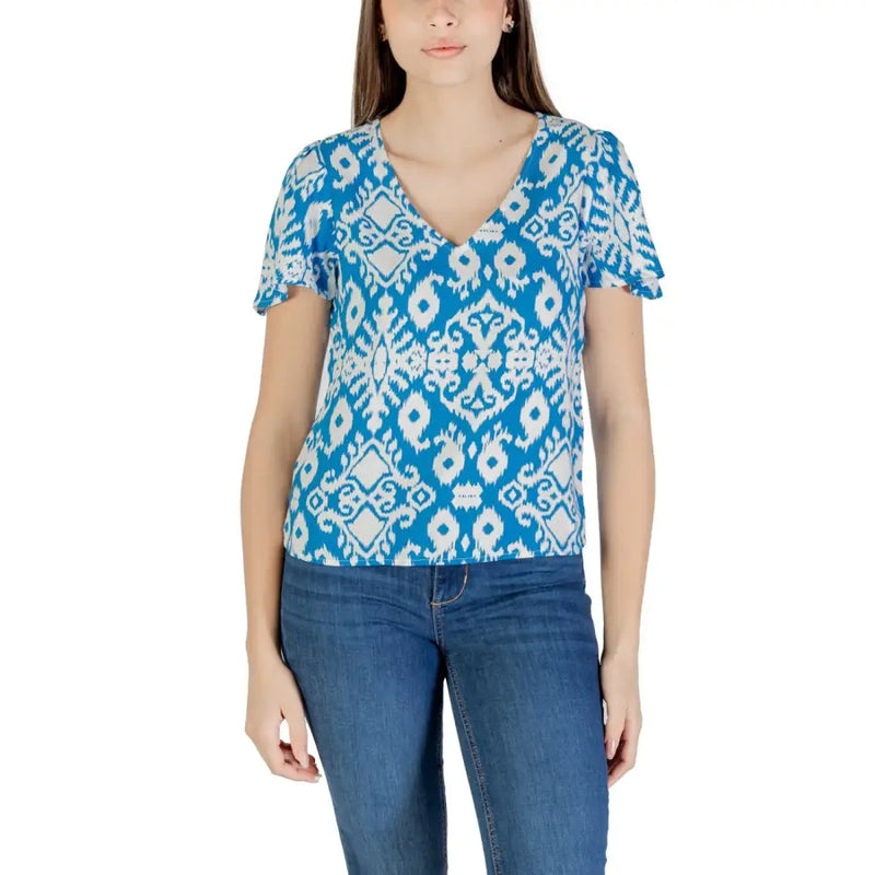 A vibrant blue and white ikat patterned v neck viscose blouse with ruffled short sleeves by Vero Moda