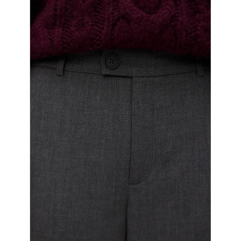 Vero moda women grey trousers are dark gray wool blend with a subtle textured weave and a single black button waistband